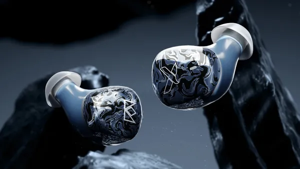 drift true-wireless earbuds floating on a dark blue background
