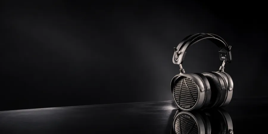 PULSE ANC headphones on a dark reflective surface